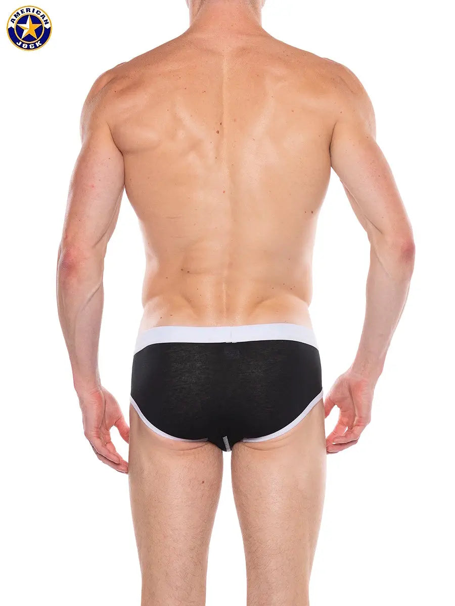 Men's black core brief with white waistband shown from the back featuring a snug fit by AMERICAN JOCK