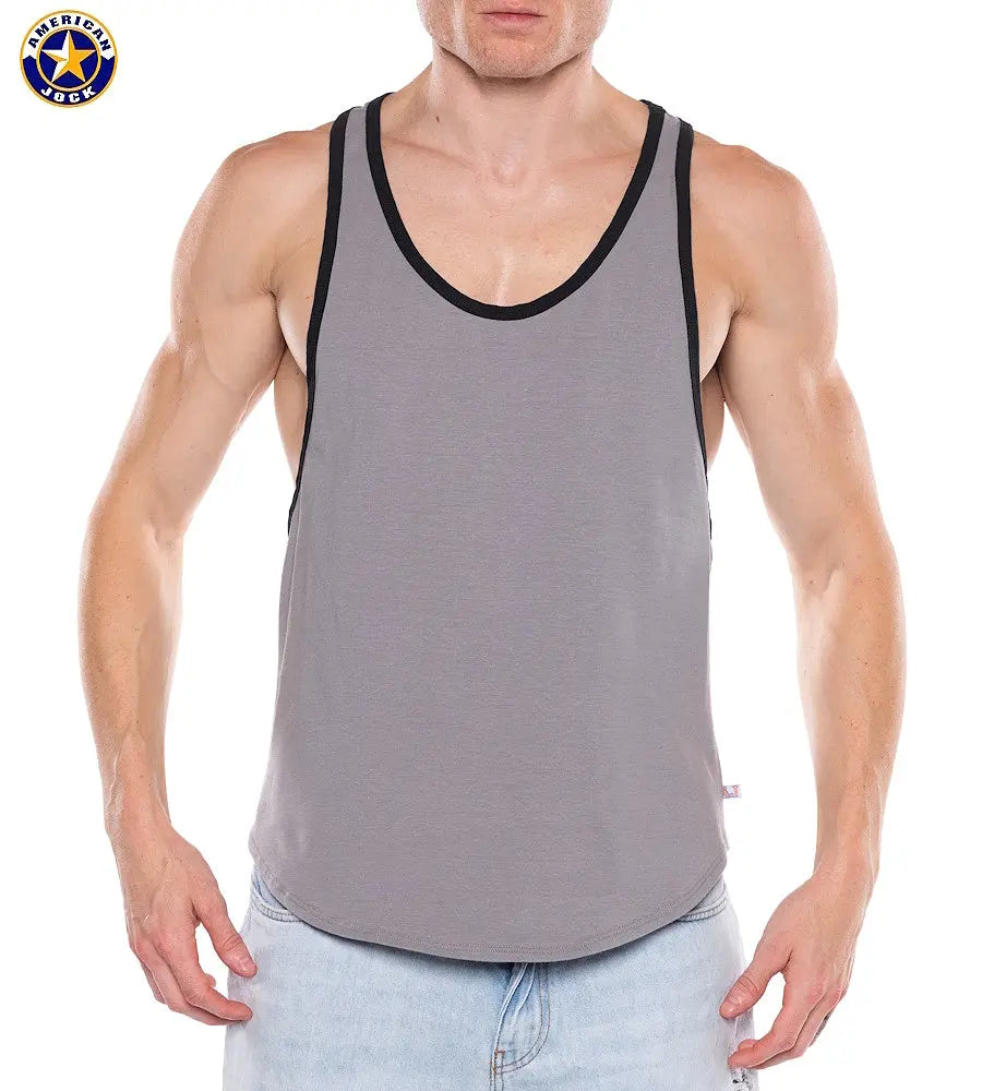 Men's platinum tank top with black trim made of soft material featuring a sleeveless design modeled by a man by AMERICAN JOCK