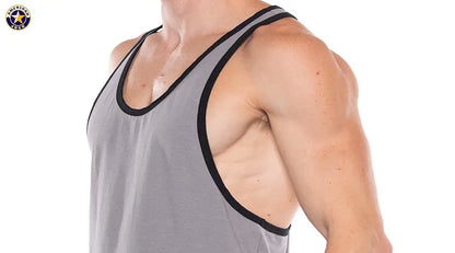 Men's platinum tank top with black trim featuring a sleeveless design and a fitted cut worn by a model by AMERICAN JOCK