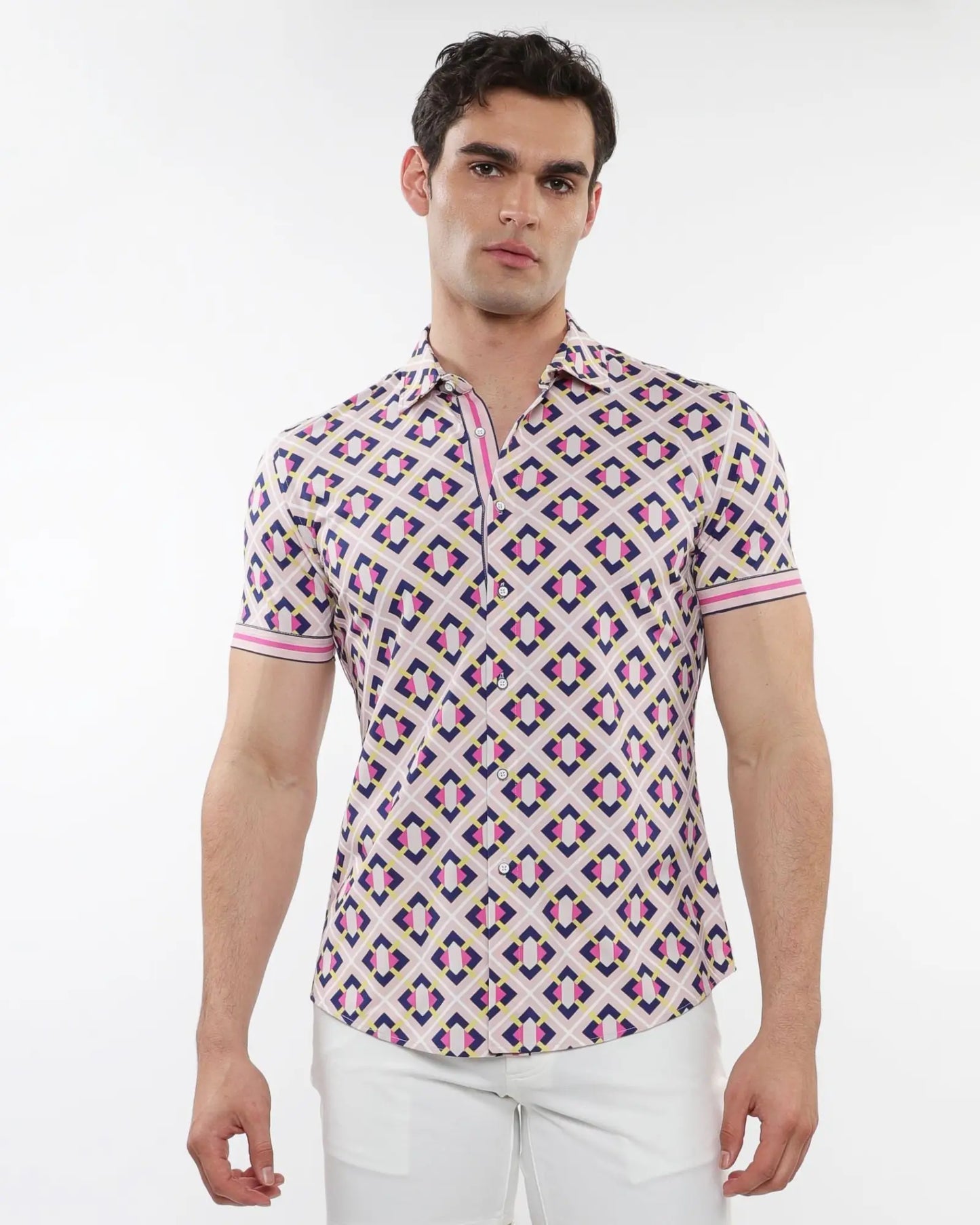 A man wearing a grid parquet printed performance short-sleeved shirt with pink purple and beige geometric pattern