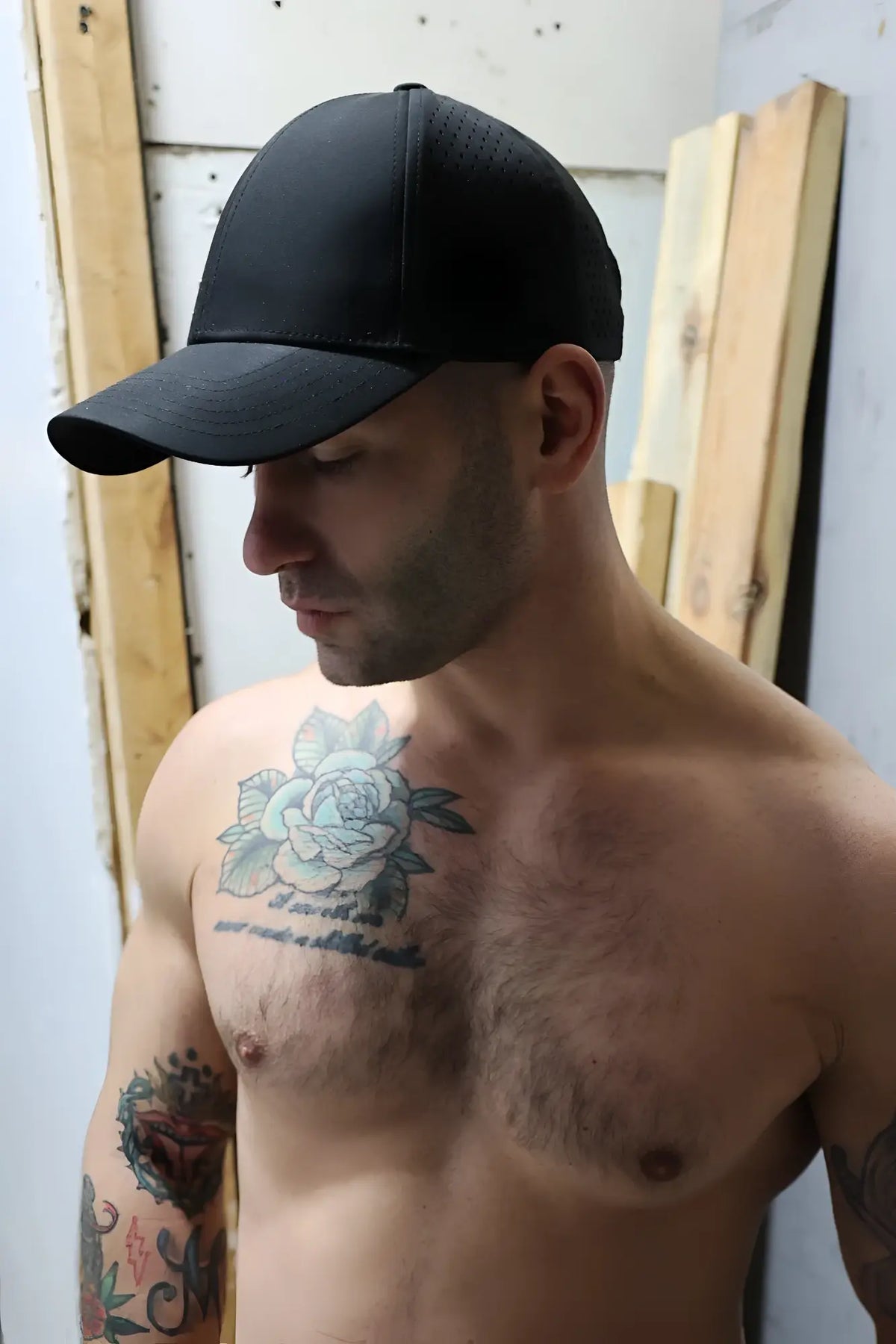 Black Gymnetixxx hat with structured crown and curved brim made for casual and athletic wear
