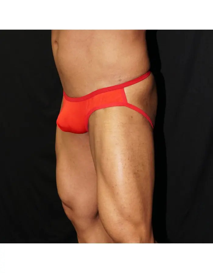 Red half bikini jockstrap underwear by Arroyman featuring a minimal design and contrasting waistband shown on a model.
