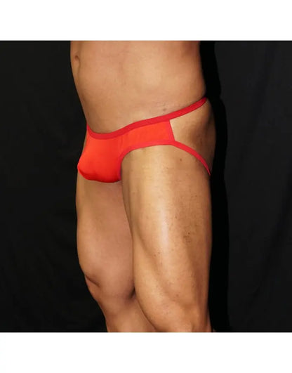 Red half bikini jockstrap underwear by Arroyman featuring a minimal design and contrasting waistband shown on a model.