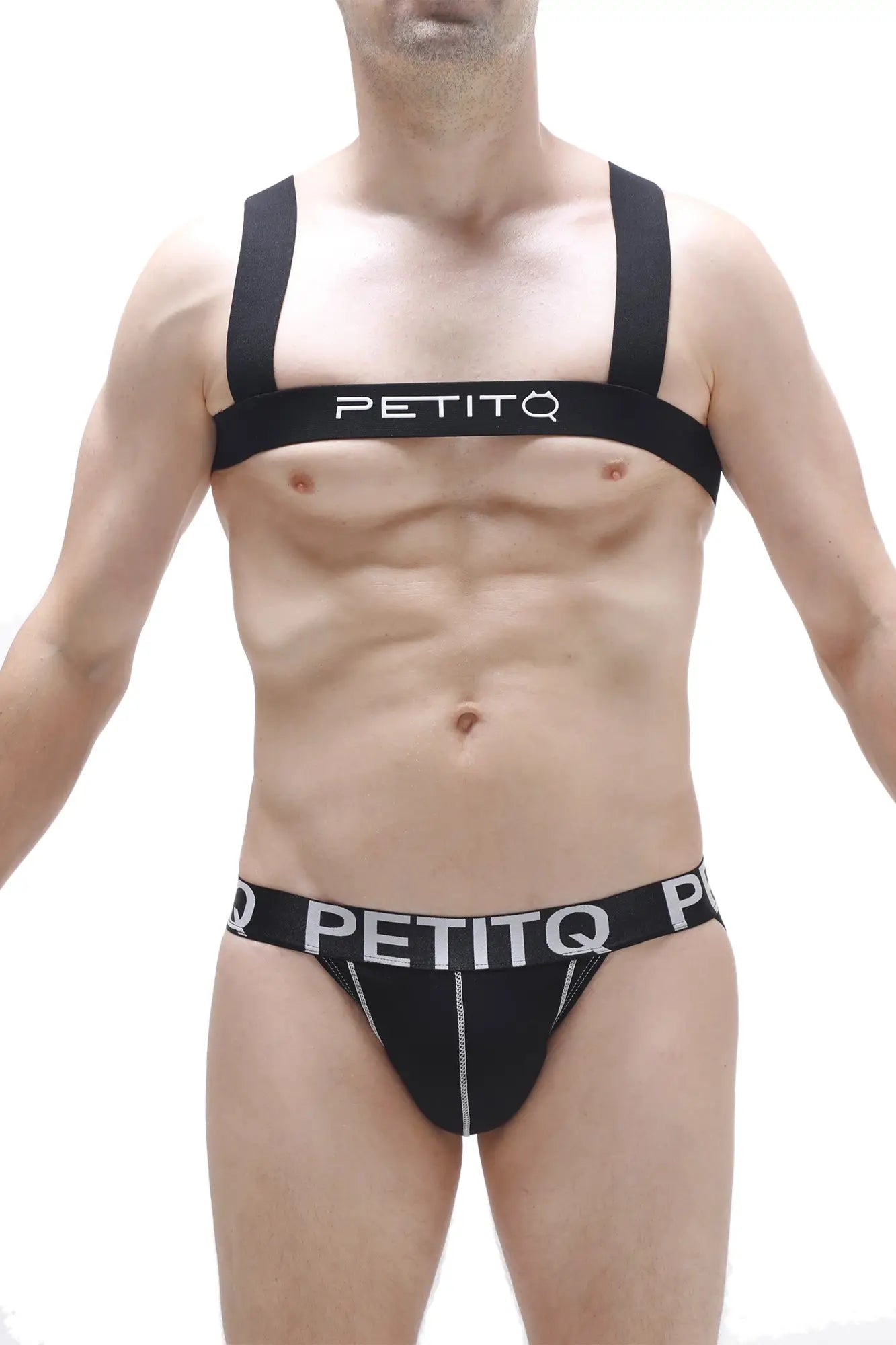 Black petitq branded athletic supporter with white lettering and zipper detail shown from the back side