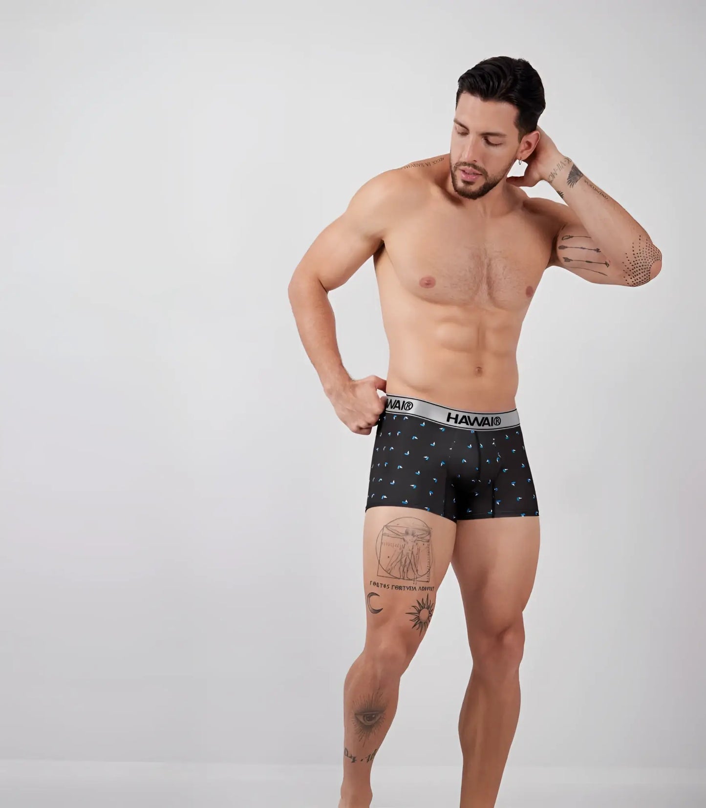 Black hawaii boxer briefs in printed microfiber with small blue geometric patterns and a gray waistband with brand name