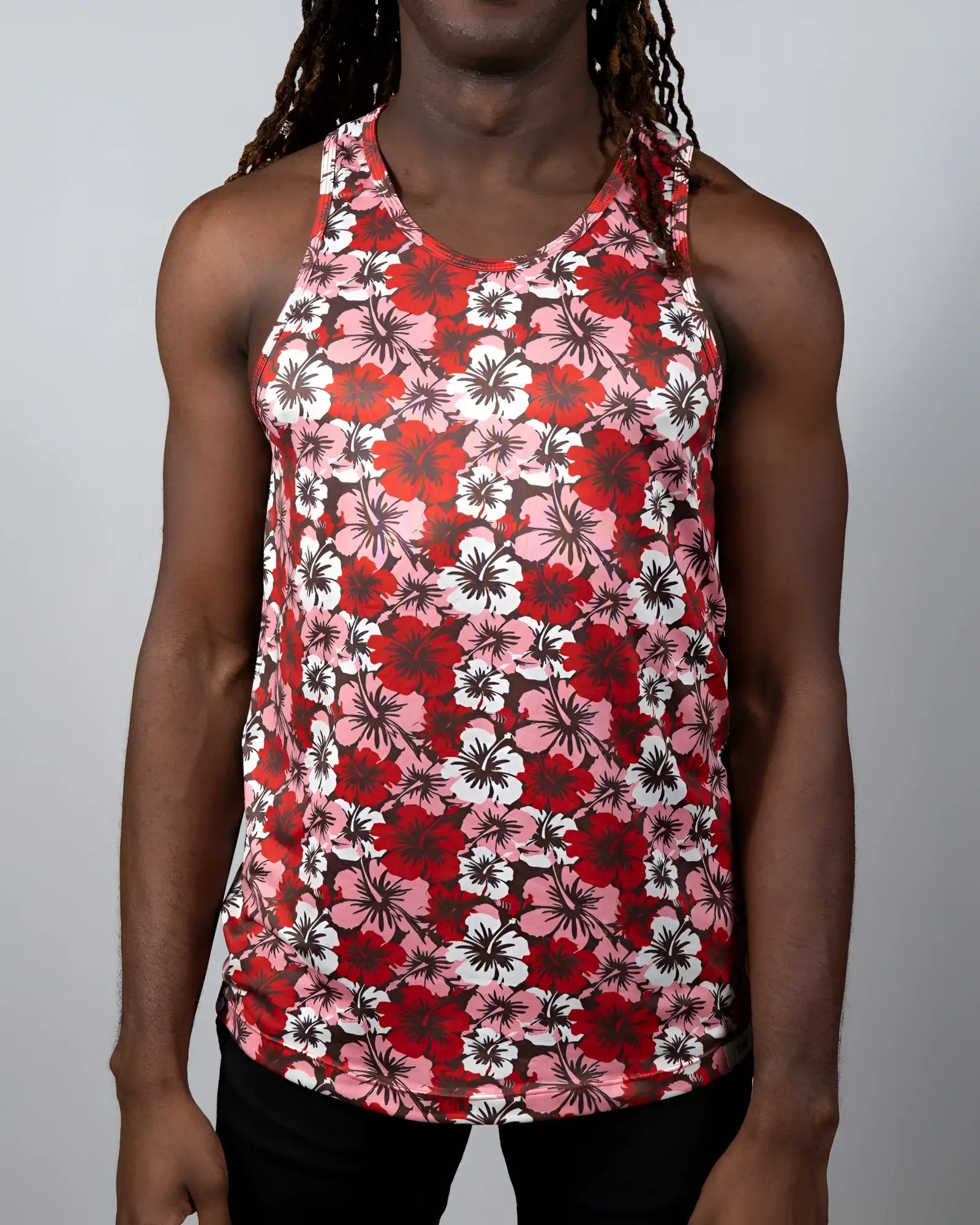 A vibrant red pink and white hawaiian hibiscus print tank top with round neckline perfect for casual summer wear