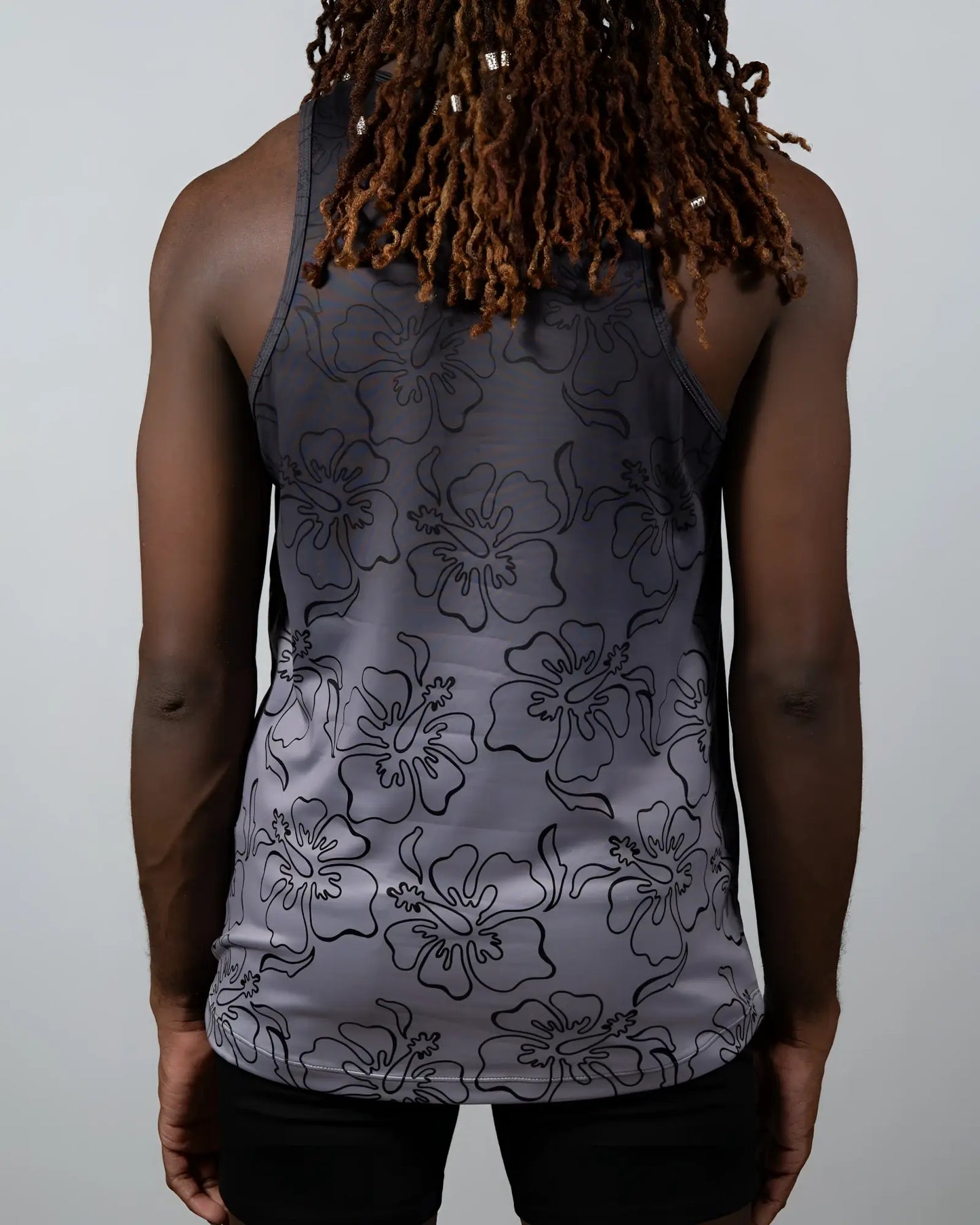 Gray hibiscus ombre print tank top with black outlined hibiscus flower pattern in a lightweight fabric