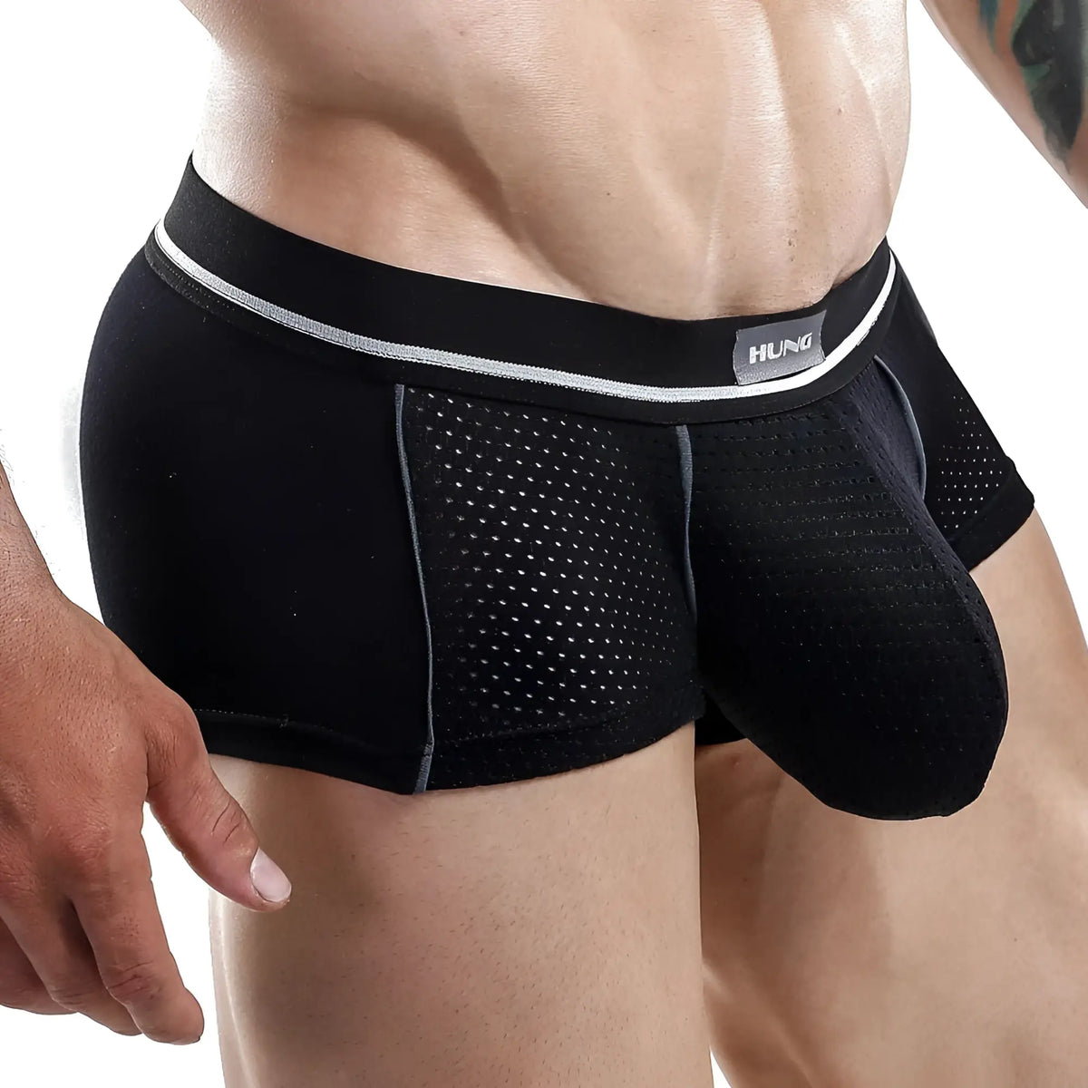 Black hung brand menâ€™s boxer trunk with perforated mesh design and silver trim for breathable comfort