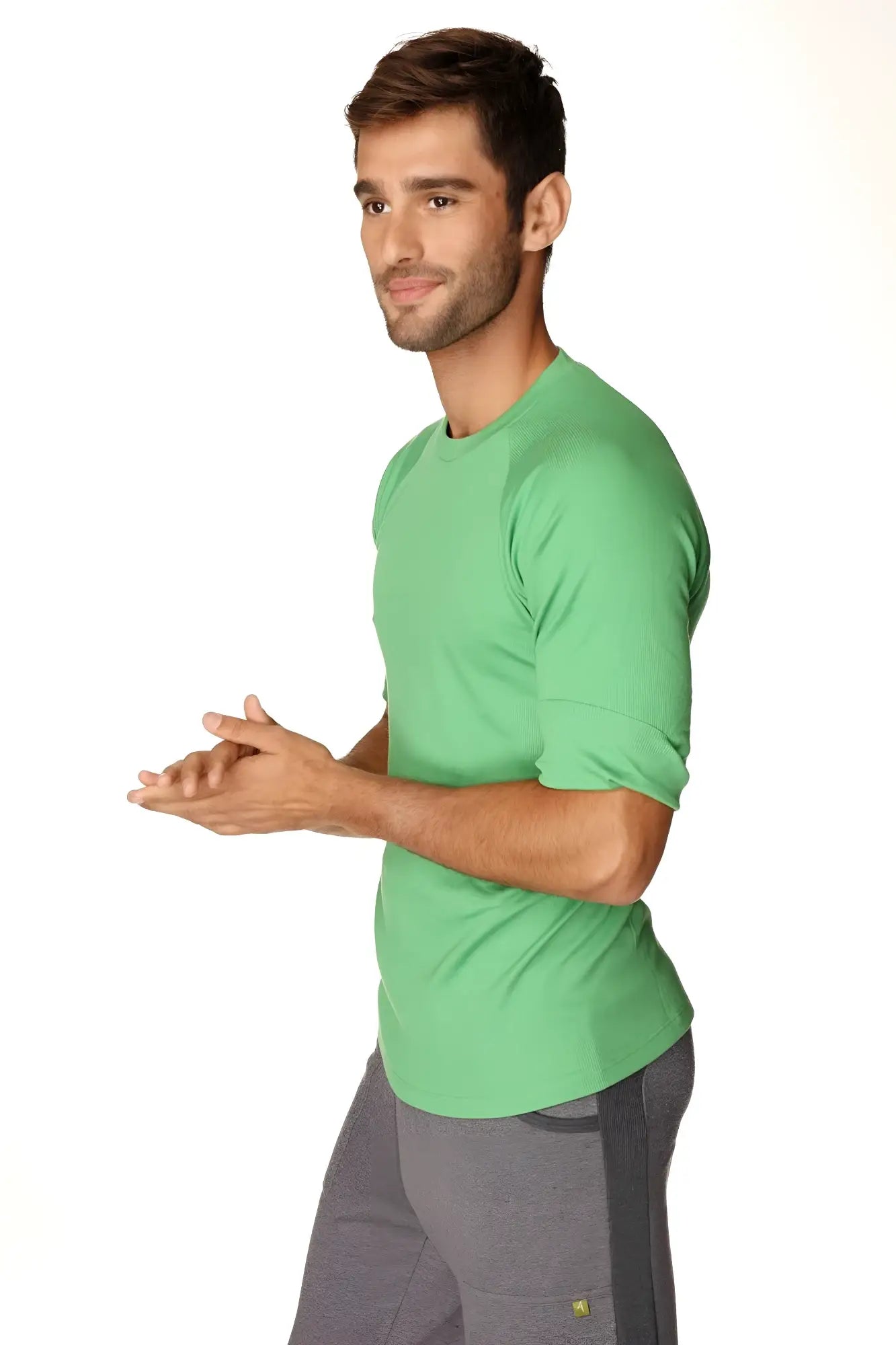 A vibrant bamboo green hybrid crew neck raglan tee made of soft cotton fabric with short sleeves