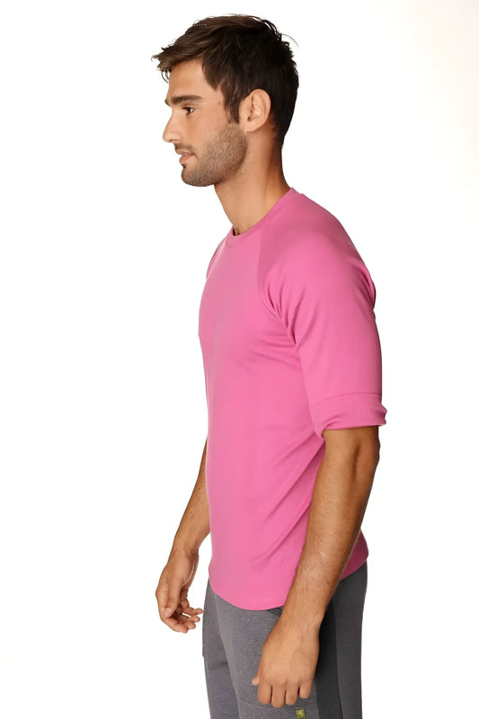 A vibrant pink hybrid crew neck raglan tee with short sleeves and rolled cuffs designed for athletic wear
