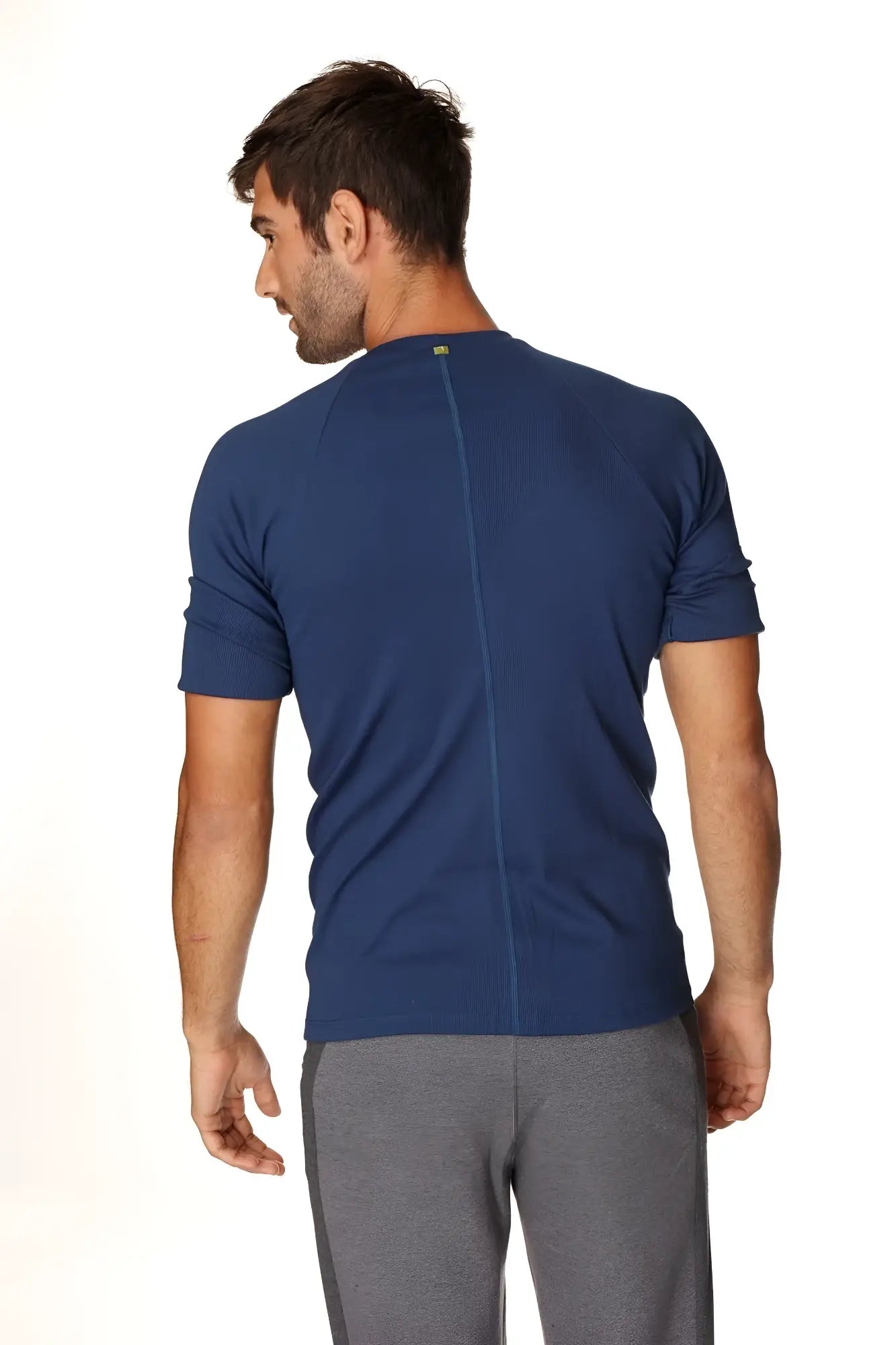 Navy blue short-sleeved hybrid crew neck raglan tee showing back with central seam designed for athletic use