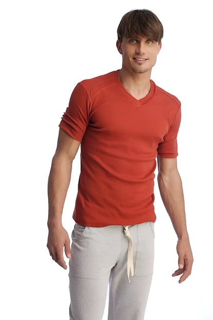 Men’s cinnabar red hybrid v-neck short-sleeve t-shirt with textured fabric and rolled-up sleeves