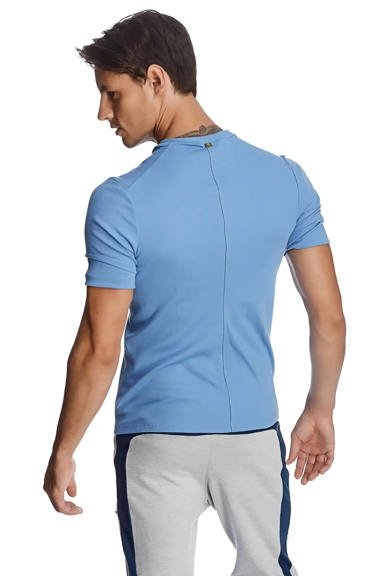 Light blue short-sleeved athletic hybrid v-neck shirt with ribbed texture and central back zipper shown from back side