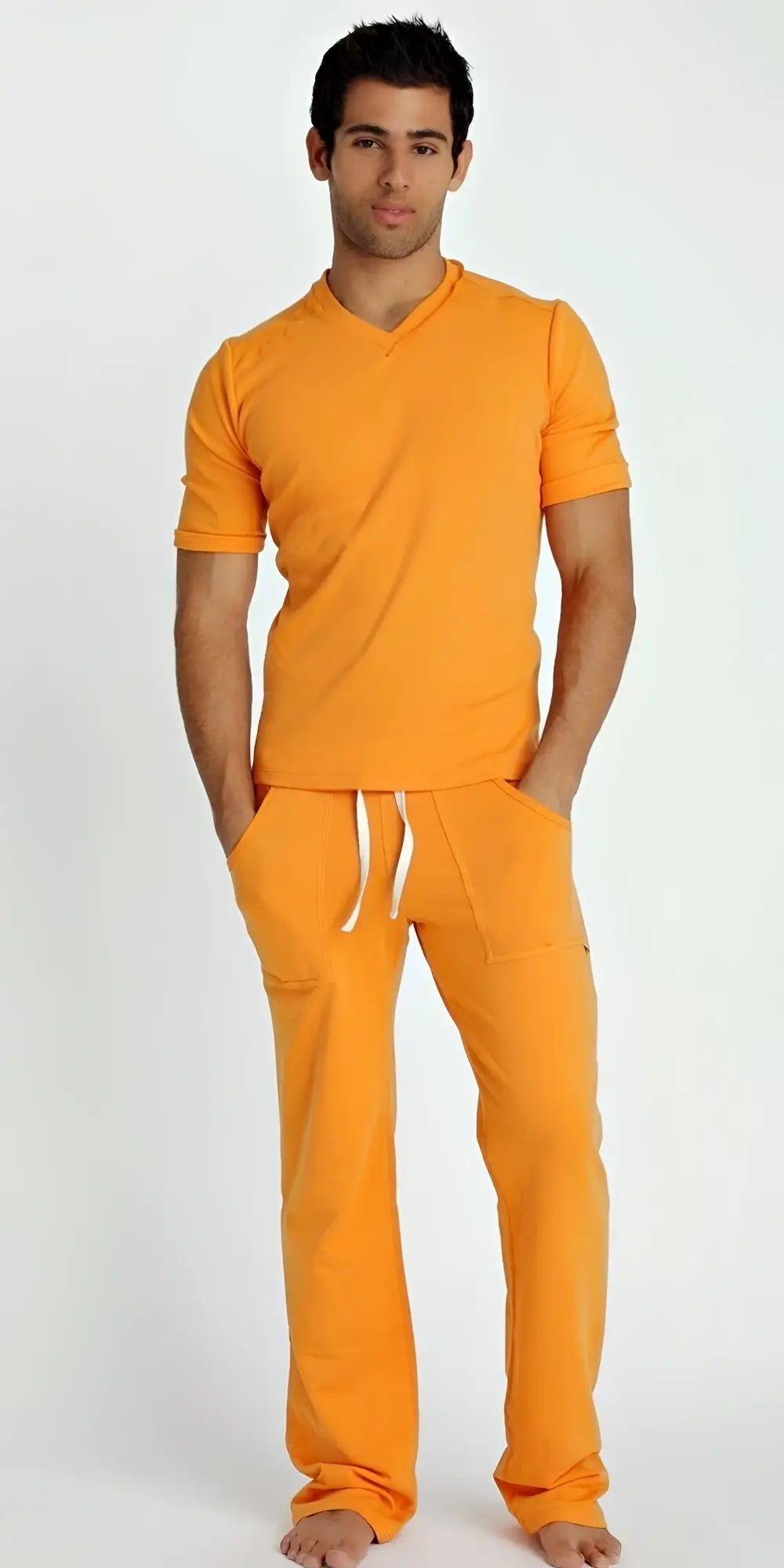 Orange short-sleeved hybrid v-neck t-shirt with matching pants and white drawstrings in sun orange color