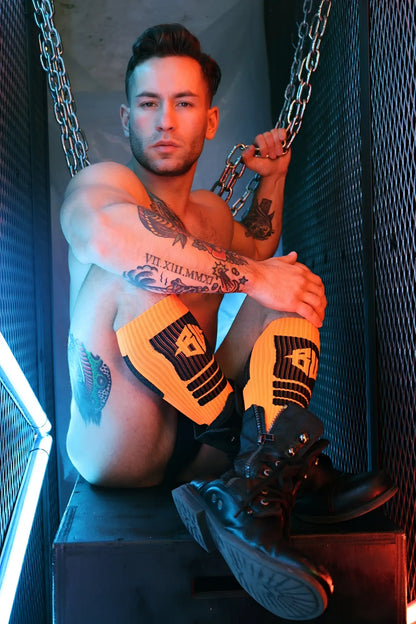 Hypnotix socks yellow and black striped knee-high socks with bold logo design in soft cotton blend material