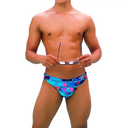 Vibrant blue and pink geometric-patterned swim trunks from Icker Sea Bricks Bikini Swimwear with a bold design