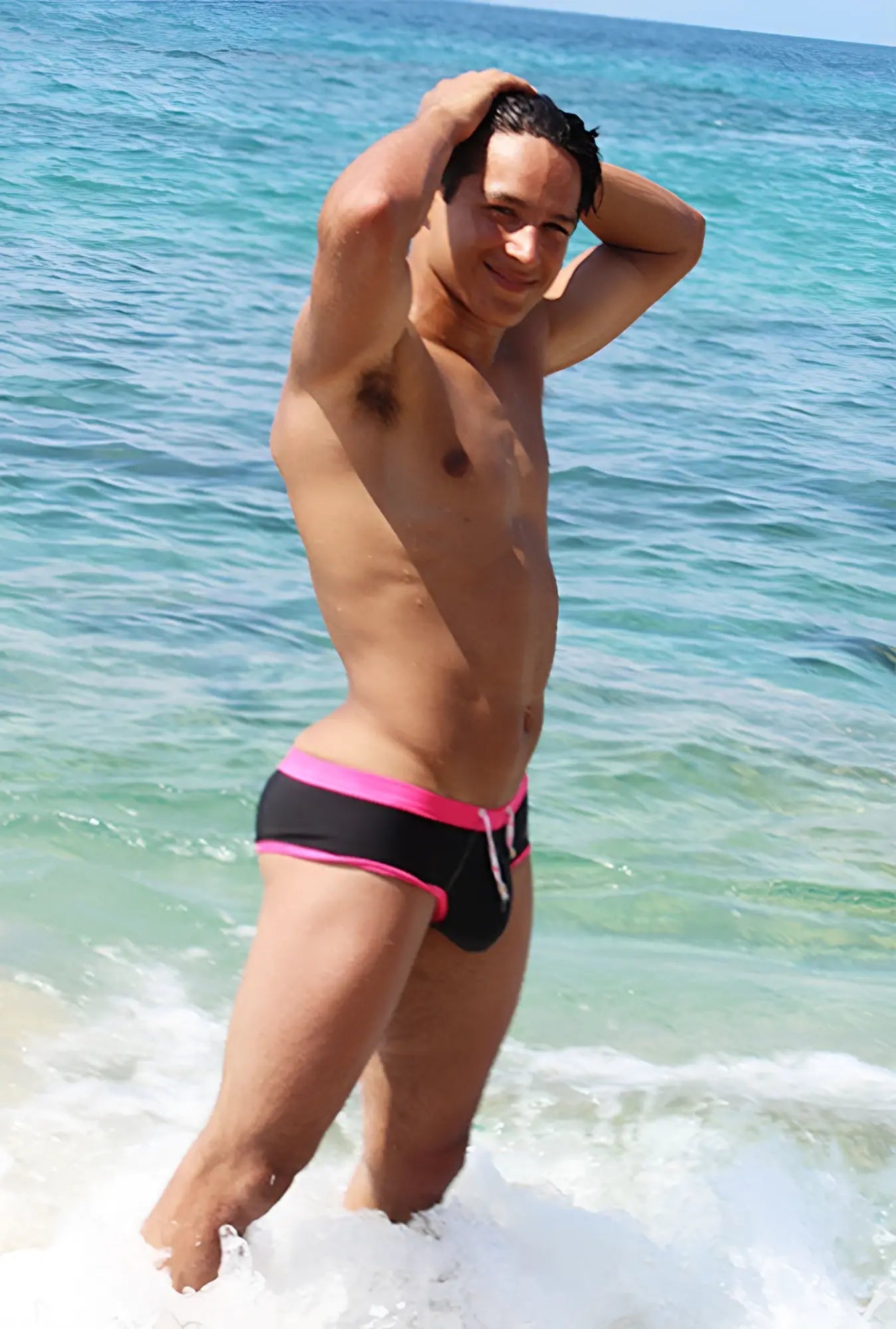 Black swim trunks with vibrant fuchsia trim and white drawstring from icker sea cheeky bikini swimwear cob-15-39