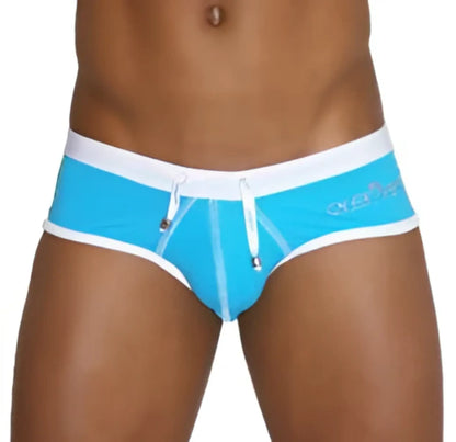 Bright blue icker sea cheeky mini bikini swim trunks with white trim and subtle side logo for swimwear use