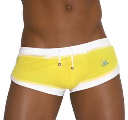 Icker sea curved hemline u shorts mango yellow swim trunks with white trim and small green logo for swimwear