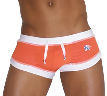 Icker Sea curved hemline u shorts square cut orange and white striped swim trunks with small logo on left hipband