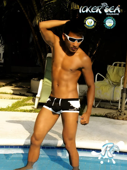 Black and white Icker Sea Eyelets square cut trunk swimwear with logo on left leg for casual beachwear