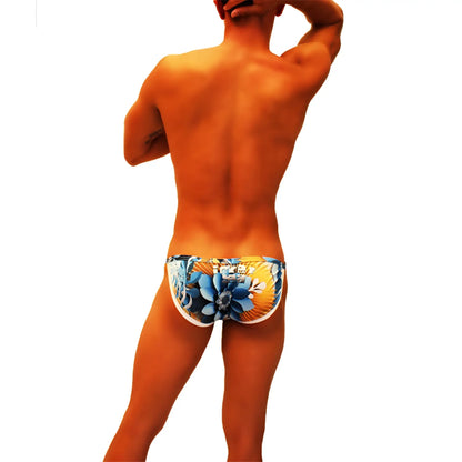 Icker Sea Greek floral micro slip bikini swimwear with vibrant blue and yellow floral-patterned swim trunks and white trim