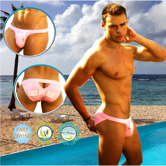 Pink icker sea men’s swim trunks showing the back with a cheeky kiss my ass graphic and cut out slip design