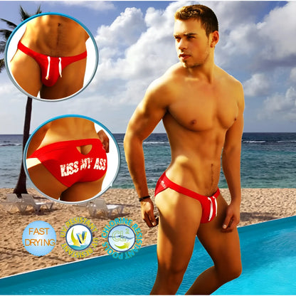 Red icker sea swim trunks with white drawstrings and kiss my ass graphic on the back for bold beachwear