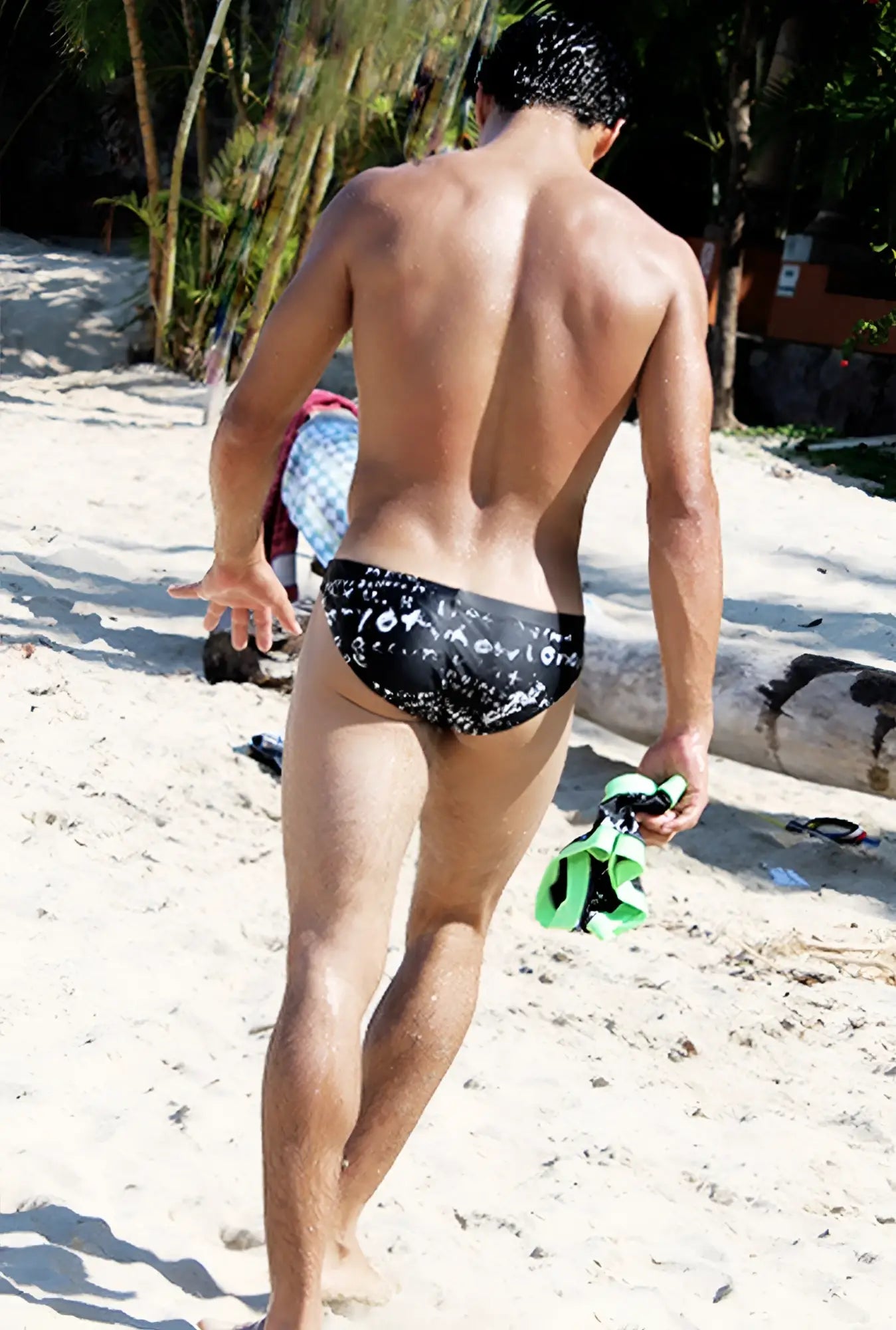 Black icker sea letters bikini swimwear trunks with white graffiti lettering and patterned design for swim use
