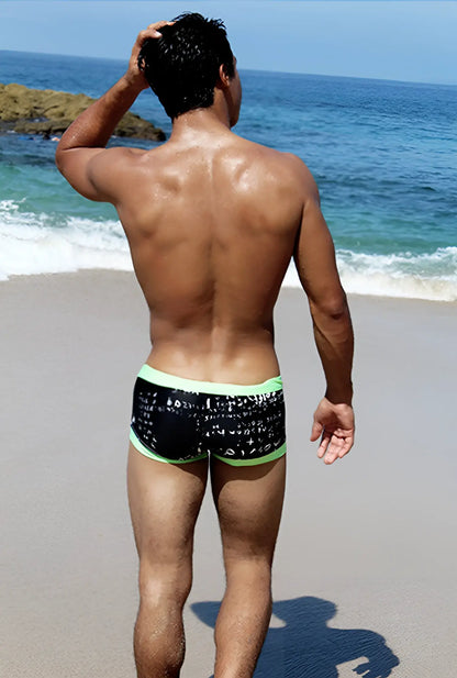 Icker Sea letters square cut trunk swimwear in black with white math equations and bright green trim