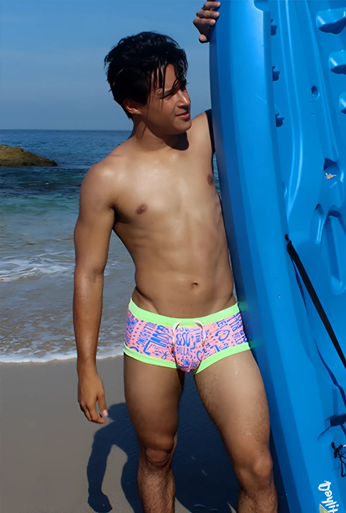 Icker Sea letters square cut trunk swimwear in pink and green with vibrant pink blue graphic pattern and neon green trim