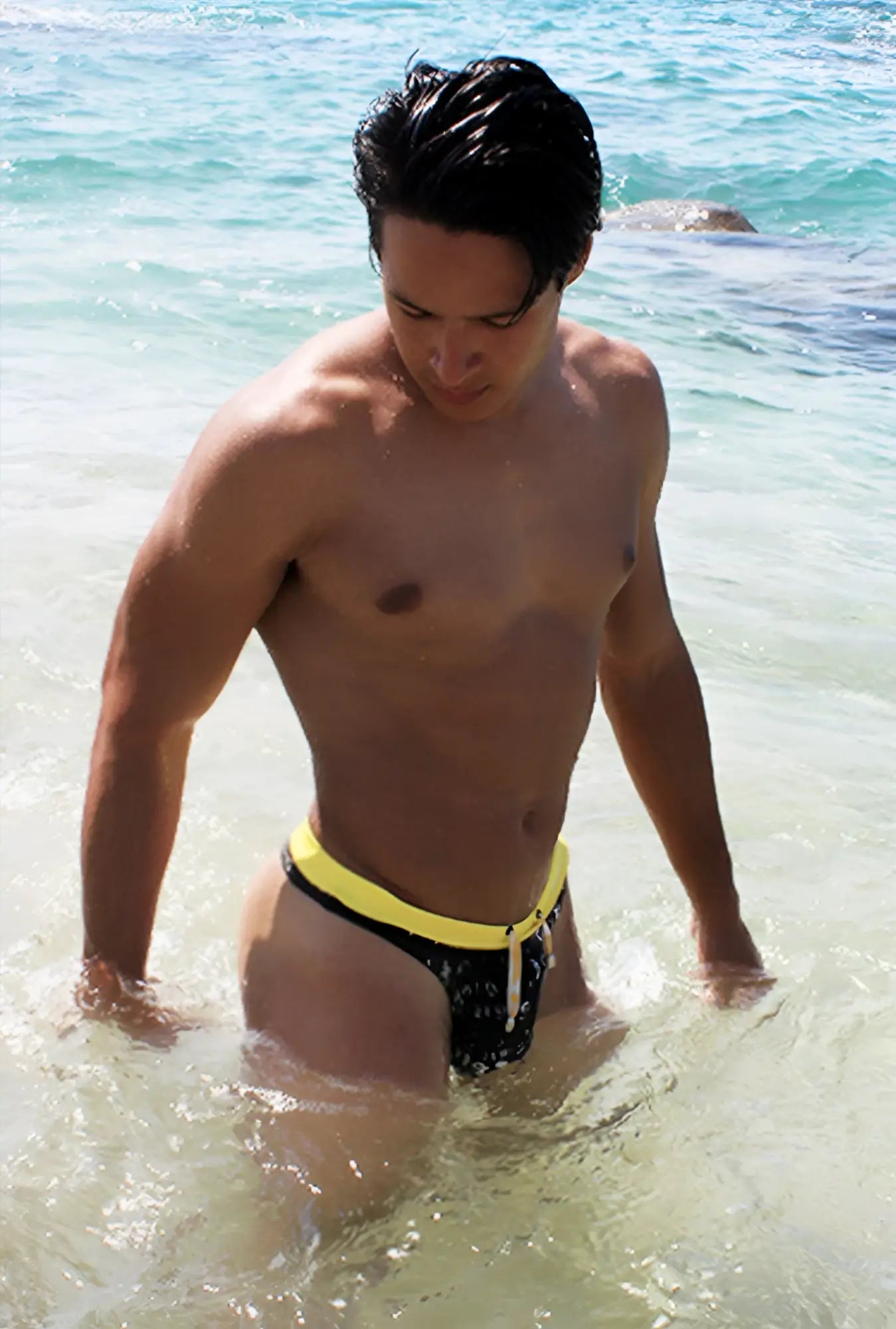 Icker Sea Letters thong swimwear black with bold yellow waistband and white drawstring swim trunks design