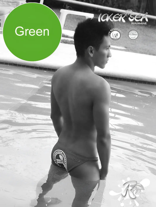 Back side of green icker sea lifeguard micro slip bikini swimwear with white logo on swim trunks