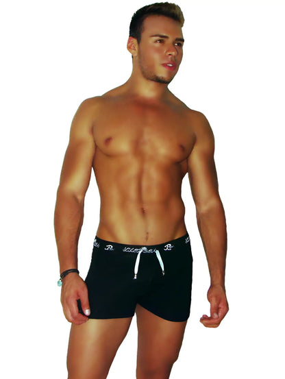 Icker Sea runner side slit shorts black with white drawstrings and subtle logo pattern on the waistband