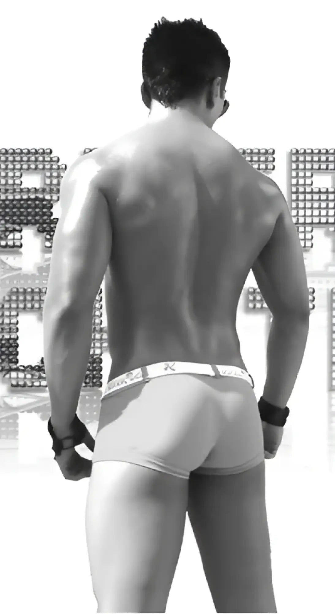 Black and white image of muscular man wearing icker sea sailor belted logo square cut trunk swimwear green and white
