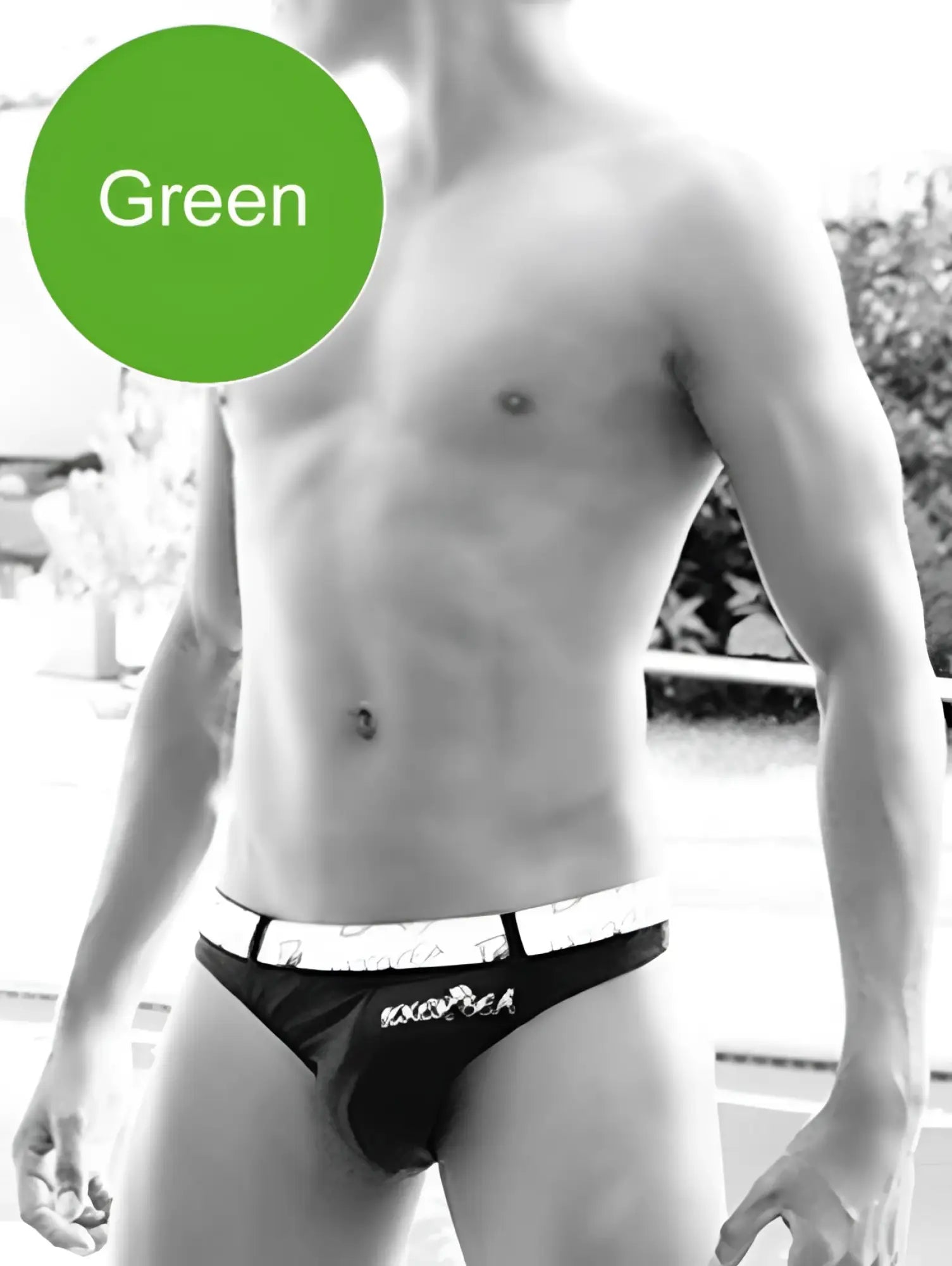 Black briefs with white waistband featuring exotica brand name in black lettering for icker sea sailor swimwear