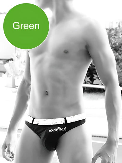 Black briefs with white waistband featuring exotica brand name in black lettering for icker sea sailor swimwear