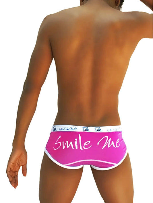 Bright pink Icker Sea Smile Me brief underwear with white trim and cursive smile me script on front
