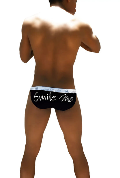 Black icker sea smile me microslip bikini briefs with white smile me text and patterned waistband front view