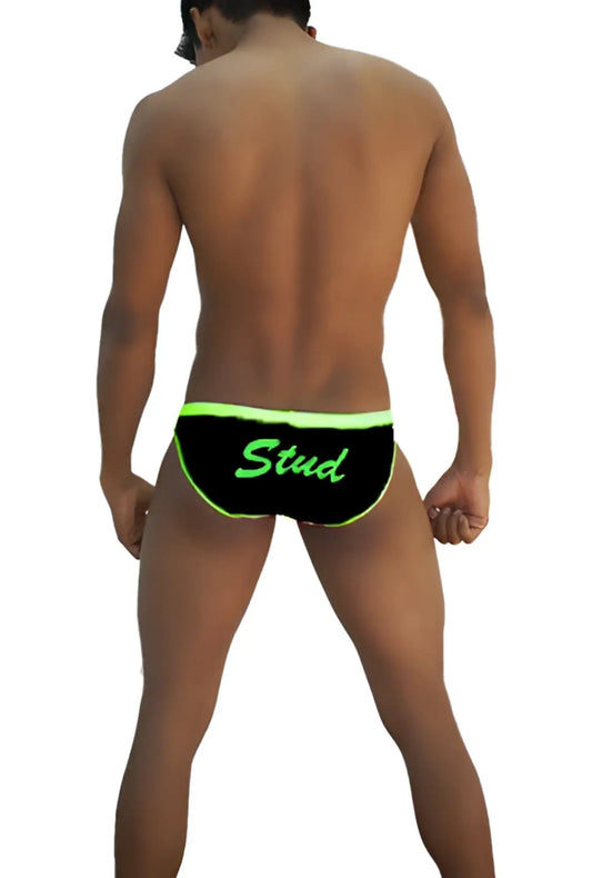 Black swim trunks with neon green trim and stud lettering from icker sea stud slip bikini underwear black green