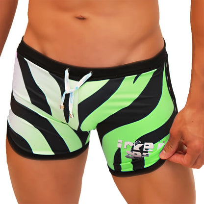 Vibrant neon green and black zebra-striped icker sea zebra open side suspender scalloped shorts swimwear with white drawstring