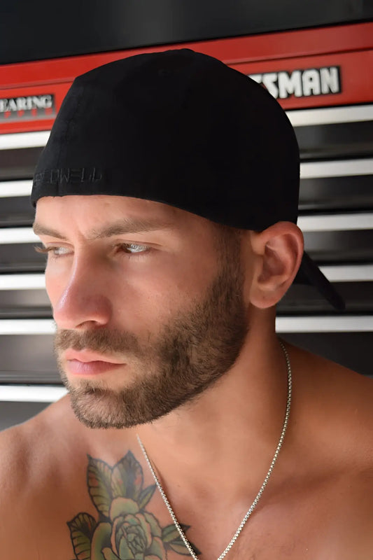 Black baseball cap featuring an embroidered logo, designed for casual wear in a sleek black color