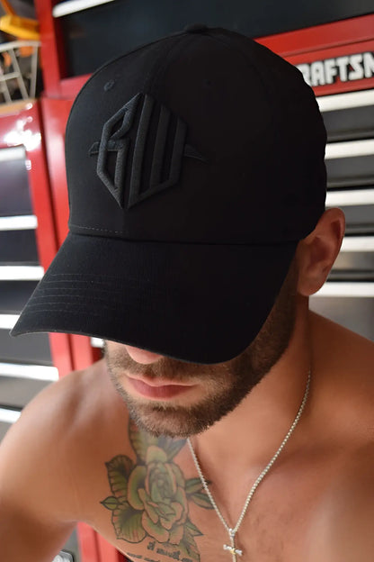 Black baseball cap with subtle raised geometric logo embroidered in matching black thread, ICON cap black