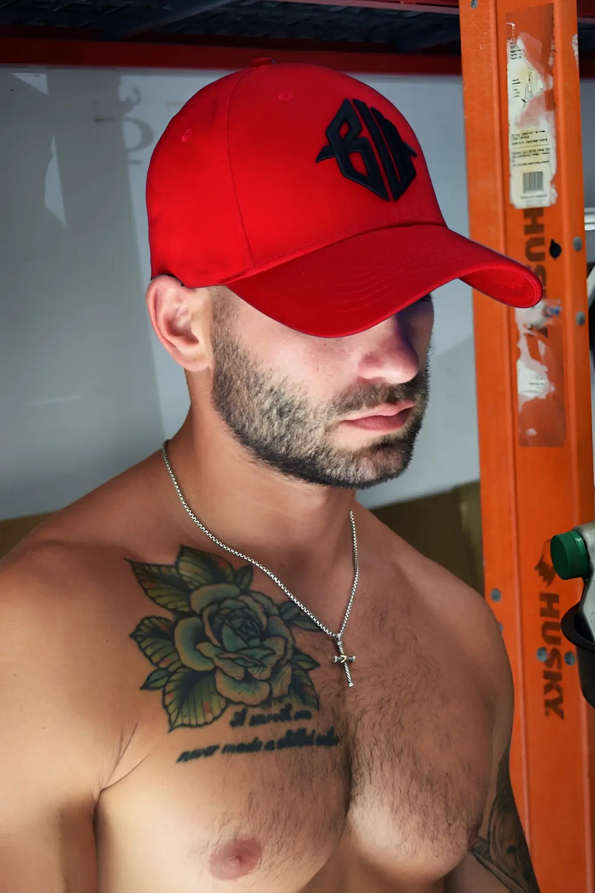 Red icon cap baseball hat with black embroidered logo made of breathable fabric for casual wear