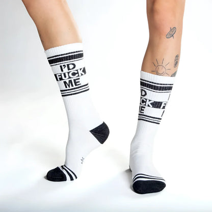 White crew socks with black text id fuck me and matching black stripes toe caps and heel accents for casual wear
