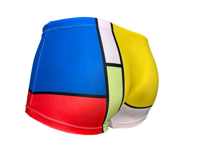 Colorful square cut men's swimsuit by Maris Equi featuring blue red yellow and green geometric patterns.
