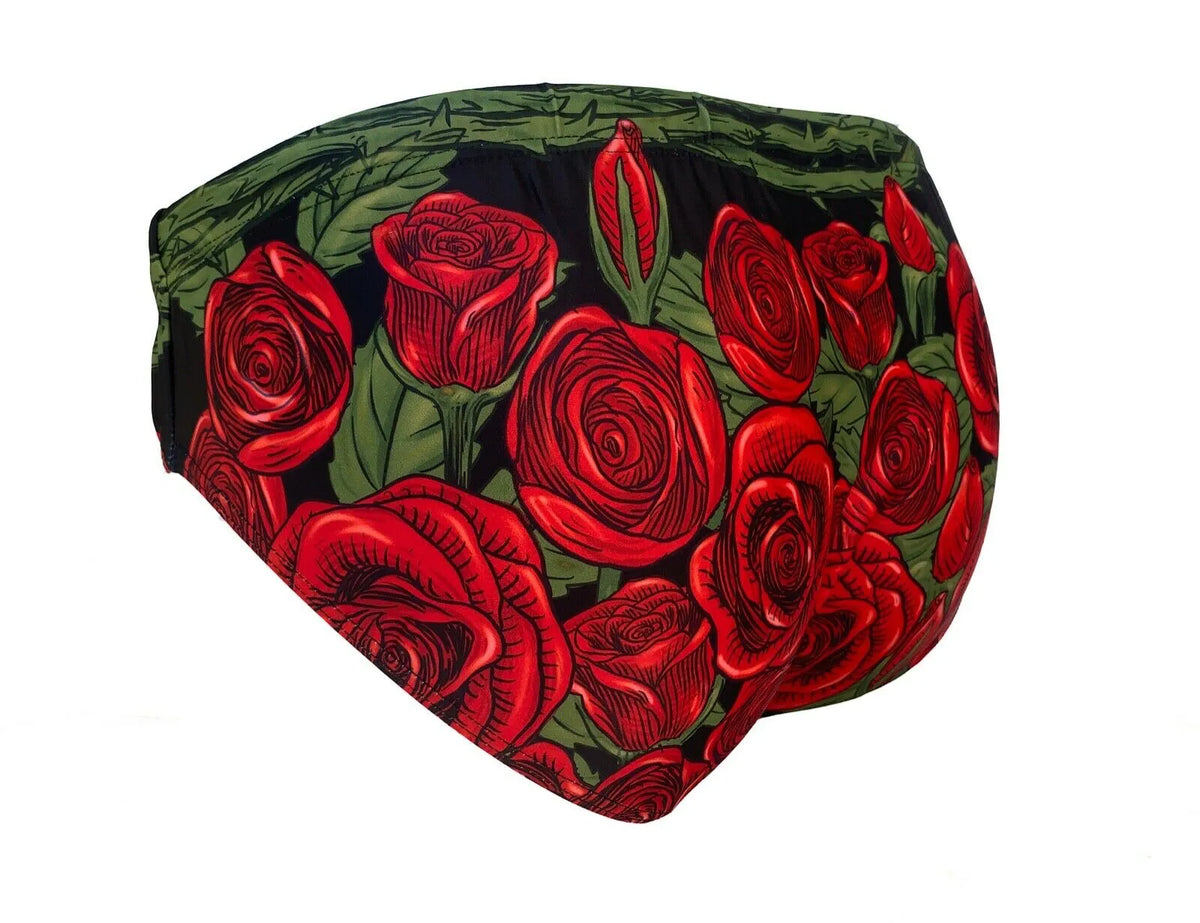 Men's swim briefs in black with vibrant red rose print featuring a snug fit by Maris Equi.
