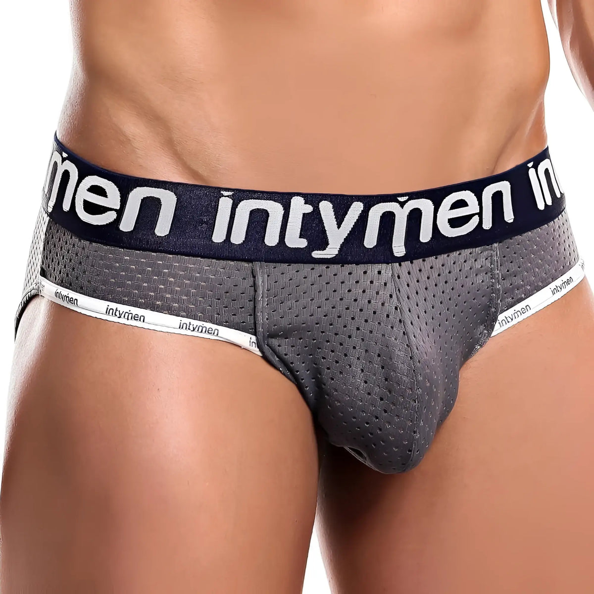 Gray mesh menâ€™s briefs with navy blue waistband and white intymen branding from Intymen INE018 jockstrap collection