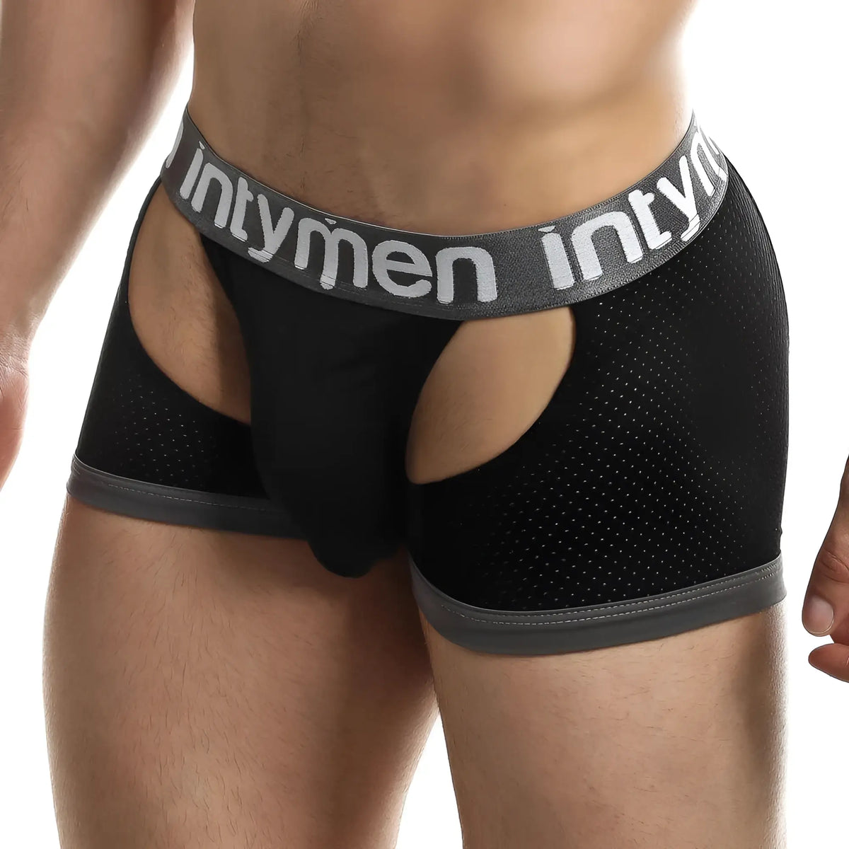 Black mesh briefs jockstrap with gray elastic waistband and leg openings featuring intymen brand name in white