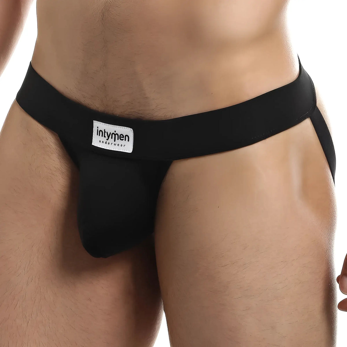 Black Intymen INE020 jockstrap with smooth form-fitting design and branded label on the waistband front side